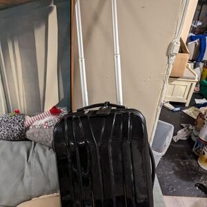 Black hard shell carry on suitcase